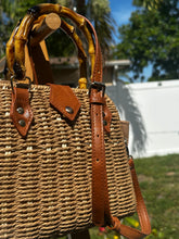 Bamboo Handle Woven Tote showcasing its bamboo handles and woven texture, perfect for beach outings and stylish adventures.
