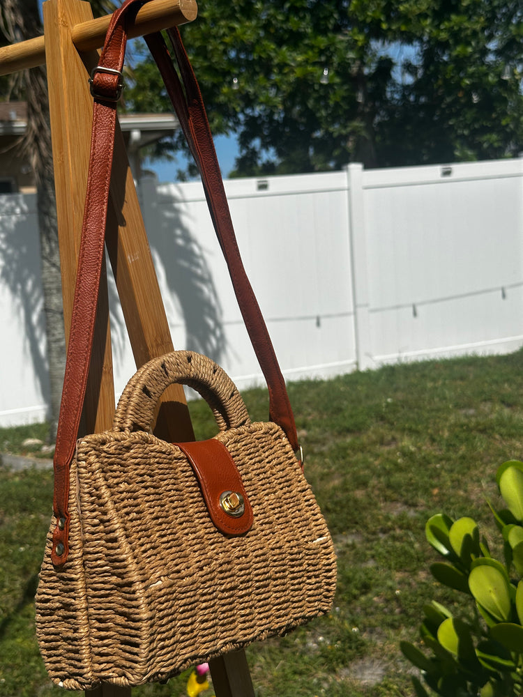 Mini Coastal Crossbody Bag with a stylish woven design and brown leather strap, perfect for beach outings and city adventures.